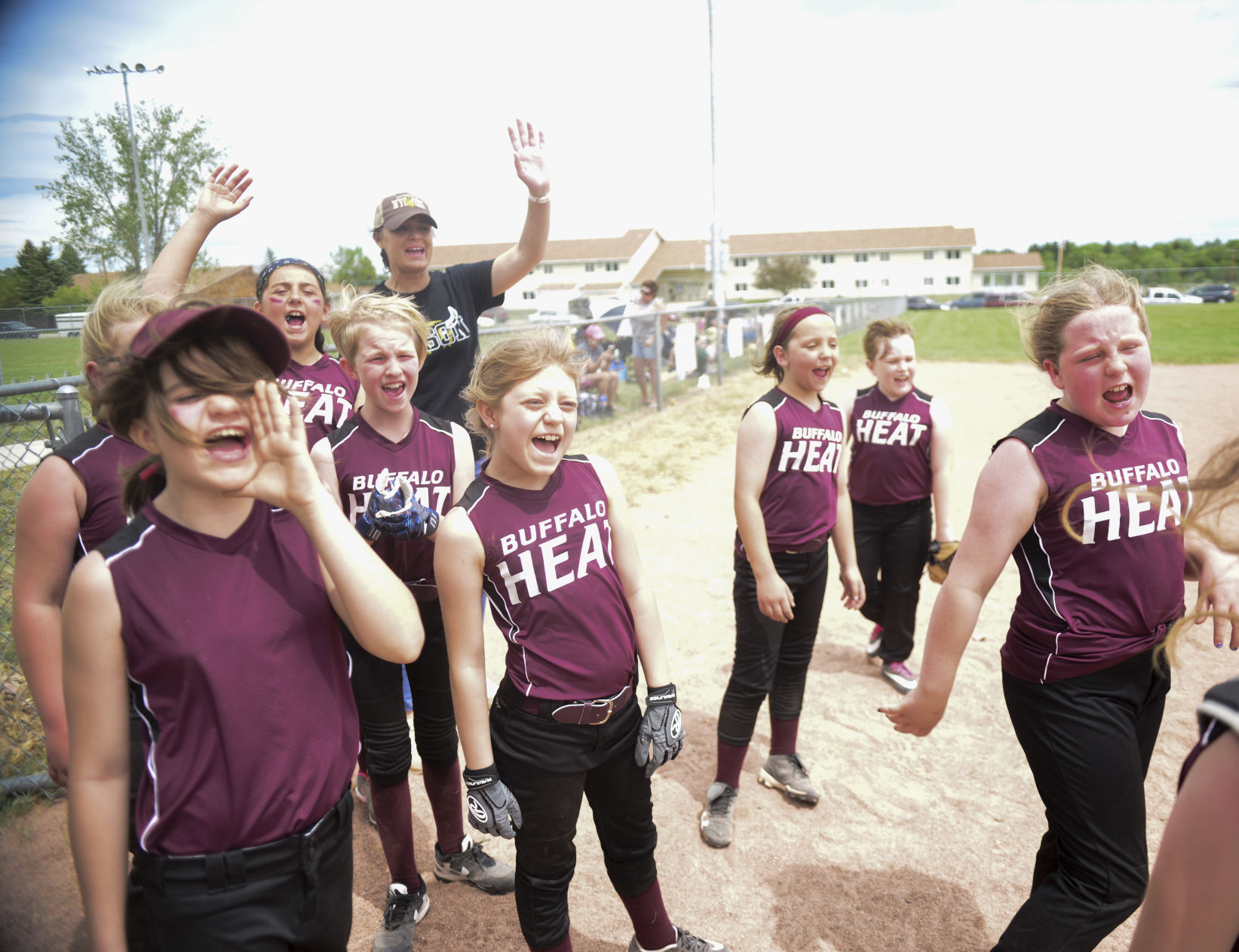 Buffalo’s 10U team screams a final “Good game Blue Jays” after the game